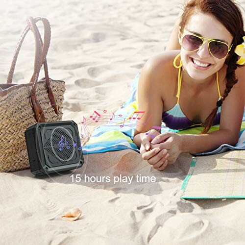 Woman on beach with portable speaker and 15 hours playtime