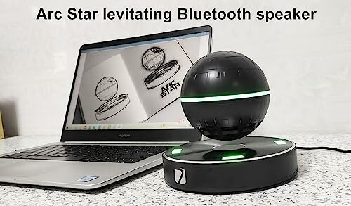 Levitating Bluetooth speaker in front of a laptop