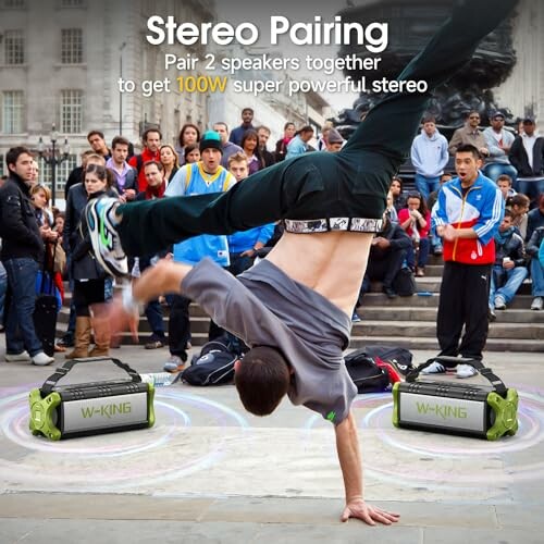 Breakdancer performing with crowd and W-King speakers.