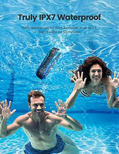 People swimming underwater with waterproof speaker.